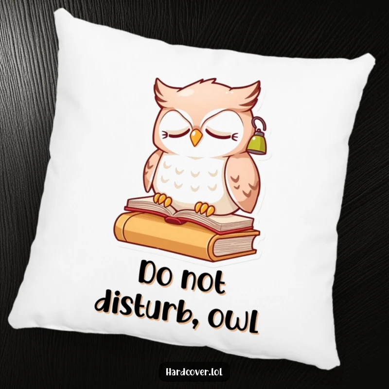 Funny sleepy owl character perched on a book, wearing a small reading lamp, on a soft decorative pillow.