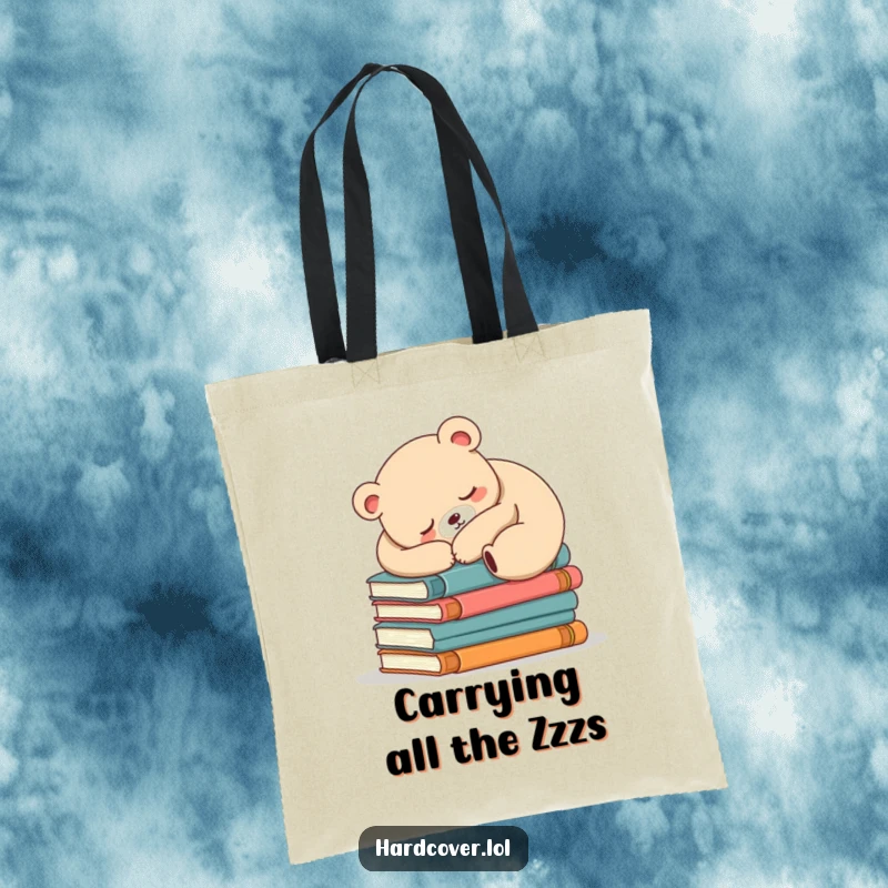 Funny sleepy bear illustration napping soundly atop a thick stack of books, making this tote bag a reader's dream.